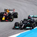 BARCELONA, SPAIN - MAY 09: Lewis Hamilton of Great Britain driving the (44) Mercedes AMG Petronas F1 Team Mercedes W12 leads Max Verstappen of the Netherlands driving the (33) Red Bull Racing RB16B Honda on track during the F1 Grand Prix of Spain at Circuit de Barcelona-Catalunya on May 09, 2021 in Barcelona, Spain. (Photo by Bryn Lennon/Getty Images)