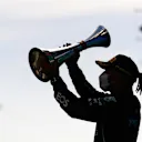 BARCELONA, SPAIN - MAY 09: Race winner Lewis Hamilton of Great Britain and Mercedes GP celebrates with his trophy on the podium during the F1 Grand Prix of Spain at Circuit de Barcelona-Catalunya on May 09, 2021 in Barcelona, Spain. (Photo by Mario Renzi - Formula 1/Formula 1 via Getty Images)
