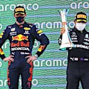 BARCELONA, SPAIN - MAY 09: Race winner Lewis Hamilton of Great Britain and Mercedes GP and second placed Max Verstappen of Netherlands and Red Bull Racing celebrate with sparkling wine on the podium during the F1 Grand Prix of Spain at Circuit de Barcelona-Catalunya on May 09, 2021 in Barcelona, Spain. (Photo by Bryn Lennon/Getty Images)