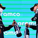 BARCELONA, SPAIN - MAY 09:  Lewis Hamilton of Great Britain  Mercedes AMG Petronas celebrates on the podium with Valtteri Bottas of Finland and Mercedes AMG Petronas after winning the F1 Grand Prix of Spain at Circuit de Barcelona-Catalunya on May 09, 2021 in Barcelona, Spain. (Photo by Dan Istitene - Formula 1/Formula 1 via Getty Images)