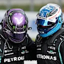 SPIELBERG, AUSTRIA - JUNE 27: Second placed Lewis Hamilton of Great Britain and Mercedes GP and third placed Valtteri Bottas of Finland and Mercedes GP hug in parc ferme during the F1 Grand Prix of Styria at Red Bull Ring on June 27, 2021 in Spielberg, Austria. (Photo by Darko Vojinovic - Pool/Getty Images)