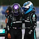 SPIELBERG, AUSTRIA - JUNE 27: Second placed Lewis Hamilton of Great Britain and Mercedes GP and third placed Valtteri Bottas of Finland and Mercedes GP hug in parc ferme during the F1 Grand Prix of Styria at Red Bull Ring on June 27, 2021 in Spielberg, Austria. (Photo by Dan Istitene - Formula 1/Formula 1 via Getty Images)