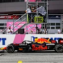 SPIELBERG, AUSTRIA - JUNE 27: Race winner Max Verstappen of the Netherlands driving the (33) Red Bull Racing RB16B Honda takes the chequered flag during the F1 Grand Prix of Styria at Red Bull Ring on June 27, 2021 in Spielberg, Austria. (Photo by Bryn Lennon/Getty Images)