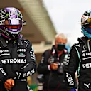 ISTANBUL, TURKEY - OCTOBER 09: Pole position qualifier Lewis Hamilton of Great Britain and Mercedes GP and second place qualifier Valtteri Bottas of Finland and Mercedes GP celebrate in parc ferme during qualifying ahead of the F1 Grand Prix of Turkey at Intercity Istanbul Park on October 09, 2021 in Istanbul, Turkey. (Photo by Dan Istitene - Formula 1/Formula 1 via Getty Images)