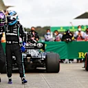 ISTANBUL, TURKEY - OCTOBER 09: Pole position qualifier Lewis Hamilton of Great Britain and Mercedes GP and second place qualifier Valtteri Bottas of Finland and Mercedes GP celebrate in parc ferme during qualifying ahead of the F1 Grand Prix of Turkey at Intercity Istanbul Park on October 09, 2021 in Istanbul, Turkey. (Photo by Dan Istitene - Formula 1/Formula 1 via Getty Images)
