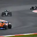 ISTANBUL, TURKEY - OCTOBER 10: Lando Norris of Great Britain driving the (4) McLaren F1 Team MCL35M Mercedes leads Lance Stroll of Canada driving the (18) Aston Martin AMR21 Mercedes during the F1 Grand Prix of Turkey at Intercity Istanbul Park on October 10, 2021 in Istanbul, Turkey. (Photo by Dan Mullan/Getty Images)