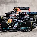 AUSTIN, TEXAS - OCTOBER 24: Lewis Hamilton of Great Britain driving the (44) Mercedes AMG Petronas F1 Team Mercedes W12 and Max Verstappen of the Netherlands driving the (33) Red Bull Racing RB16B Honda battle for position at the start during the F1 Grand Prix of USA at Circuit of The Americas on October 24, 2021 in Austin, Texas. (Photo by Clive Mason - Formula 1/Formula 1 via Getty Images)