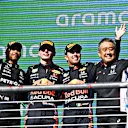 AUSTIN, TEXAS - OCTOBER 24: Race winner Max Verstappen of Netherlands and Red Bull Racing, second placed Lewis Hamilton of Great Britain and Mercedes GP, third placed Sergio Perez of Mexico and Red Bull Racing and Masashi Yamamoto of Honda celebrate on the podium during the F1 Grand Prix of USA at Circuit of The Americas on October 24, 2021 in Austin, Texas. (Photo by Clive Mason - Formula 1/Formula 1 via Getty Images)