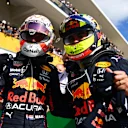 AUSTIN, TEXAS - OCTOBER 24: Race winner Max Verstappen of Netherlands and Red Bull Racing and third placed Sergio Perez of Mexico and Red Bull Racing celebrate in parc ferme during the F1 Grand Prix of USA at Circuit of The Americas on October 24, 2021 in Austin, Texas. (Photo by Clive Mason - Formula 1/Formula 1 via Getty Images)