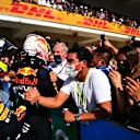 AUSTIN, TEXAS - OCTOBER 24: Race winner Max Verstappen of Netherlands and Red Bull Racing and third placed Sergio Perez of Mexico and Red Bull Racing celebrate in parc ferme during the F1 Grand Prix of USA at Circuit of The Americas on October 24, 2021 in Austin, Texas. (Photo by Clive Mason - Formula 1/Formula 1 via Getty Images)