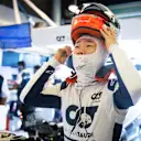 ABU DHABI, UNITED ARAB EMIRATES - NOVEMBER 18: Yuki Tsunoda of Japan and Scuderia AlphaTauri prepares to drive in the garage during practice ahead of the F1 Grand Prix of Abu Dhabi at Yas Marina Circuit on November 18, 2022 in Abu Dhabi, United Arab Emirates. (Photo by Rudy Carezzevoli/Getty Images)