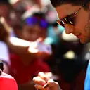 ABU DHABI, UNITED ARAB EMIRATES - NOVEMBER 19: Esteban Ocon of France and Alpine F1 interacts with the fans prior to final practice ahead of the F1 Grand Prix of Abu Dhabi at Yas Marina Circuit on November 19, 2022 in Abu Dhabi, United Arab Emirates. (Photo by Mario Renzi - Formula 1/Formula 1 via Getty Images)