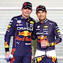 ABU DHABI, UNITED ARAB EMIRATES - NOVEMBER 19: Pole position qualifier Max Verstappen of the Netherlands and Oracle Red Bull Racing and Second placed qualifier Sergio Perez of Mexico and Oracle Red Bull Racing pose for a photo in parc ferme during qualifying ahead of the F1 Grand Prix of Abu Dhabi at Yas Marina Circuit on November 19, 2022 in Abu Dhabi, United Arab Emirates. (Photo by Mark Thompson/Getty Images)