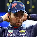 ABU DHABI, UNITED ARAB EMIRATES - NOVEMBER 19: Second placed qualifier Sergio Perez of Mexico and Oracle Red Bull Racing reacts in parc ferme during qualifying ahead of the F1 Grand Prix of Abu Dhabi at Yas Marina Circuit on November 19, 2022 in Abu Dhabi, United Arab Emirates. (Photo by Dan Istitene - Formula 1/Formula 1 via Getty Images)