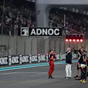 ABU DHABI, UNITED ARAB EMIRATES - NOVEMBER 19: Third placed qualifier Charles Leclerc of Monaco and Ferrari does an interview with David Coulthard in parc ferme during qualifying ahead of the F1 Grand Prix of Abu Dhabi at Yas Marina Circuit on November 19, 2022 in Abu Dhabi, United Arab Emirates. (Photo by Rudy Carezzevoli/Getty Images)