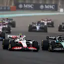 ABU DHABI, UNITED ARAB EMIRATES - NOVEMBER 20: Mick Schumacher of Germany driving the (47) Haas F1 VF-22 Ferrari and Lance Stroll of Canada driving the (18) Aston Martin AMR22 Mercedes battle for position on track during the F1 Grand Prix of Abu Dhabi at Yas Marina Circuit on November 20, 2022 in Abu Dhabi, United Arab Emirates. (Photo by Bryn Lennon - Formula 1/Formula 1 via Getty Images)