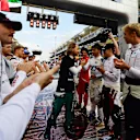 ABU DHABI, UNITED ARAB EMIRATES - NOVEMBER 20: Sebastian Vettel of Germany and Aston Martin F1 Team receives a guard of honour on the grid prior to the F1 Grand Prix of Abu Dhabi at Yas Marina Circuit on November 20, 2022 in Abu Dhabi, United Arab Emirates. (Photo by Mario Renzi - Formula 1/Formula 1 via Getty Images)