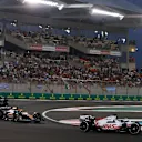 ABU DHABI, UNITED ARAB EMIRATES - NOVEMBER 20: Kevin Magnussen of Denmark driving the (20) Haas F1 VF-22 Ferrari leads Daniel Ricciardo of Australia driving the (3) McLaren MCL36 Mercedes and Mick Schumacher of Germany driving the (47) Haas F1 VF-22 Ferrari on track during the F1 Grand Prix of Abu Dhabi at Yas Marina Circuit on November 20, 2022 in Abu Dhabi, United Arab Emirates. (Photo by Joe Portlock - Formula 1/Formula 1 via Getty Images)