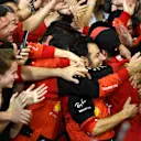 ABU DHABI, UNITED ARAB EMIRATES - NOVEMBER 20: Second placed Charles Leclerc of Monaco and Ferrari celebrates with teammates following the F1 Grand Prix of Abu Dhabi at Yas Marina Circuit on November 20, 2022 in Abu Dhabi, United Arab Emirates. (Photo by Rudy Carezzevoli/Getty Images)