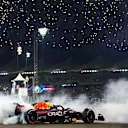 ABU DHABI, UNITED ARAB EMIRATES - NOVEMBER 20: Race winner Max Verstappen of the Netherlands driving the (1) Oracle Red Bull Racing RB18 performs a celebratory donut during the F1 Grand Prix of Abu Dhabi at Yas Marina Circuit on November 20, 2022 in Abu Dhabi, United Arab Emirates. (Photo by Dan Istitene - Formula 1/Formula 1 via Getty Images)