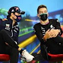 MELBOURNE, AUSTRALIA - APRIL 08: Sergio Perez of Mexico and Oracle Red Bull Racing and George Russell of Great Britain and Mercedes talk in the Drivers Press Conference prior to practice ahead of the F1 Grand Prix of Australia at Melbourne Grand Prix Circuit on April 08, 2022 in Melbourne, Australia. (Photo by Clive Mason/Getty Images)