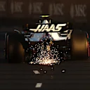 MELBOURNE, AUSTRALIA - APRIL 09: Sparks fly behind Mick Schumacher of Germany driving the (47) Haas F1 VF-22 Ferrari on track during qualifying ahead of the F1 Grand Prix of Australia at Melbourne Grand Prix Circuit on April 09, 2022 in Melbourne, Australia. (Photo by Bryn Lennon - Formula 1/Formula 1 via Getty Images)