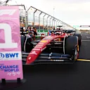 MELBOURNE, AUSTRALIA - APRIL 09: Pole position qualifier Charles Leclerc of Monaco and Ferrari stops in parc ferme during qualifying ahead of the F1 Grand Prix of Australia at Melbourne Grand Prix Circuit on April 09, 2022 in Melbourne, Australia. (Photo by Dan Istitene - Formula 1/Formula 1 via Getty Images)