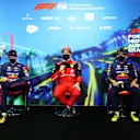 MELBOURNE, AUSTRALIA - APRIL 09: Pole position qualifier Charles Leclerc of Monaco and Ferrari (C), Second placed qualifier Max Verstappen of the Netherlands and Oracle Red Bull Racing (L) and Third placed qualifier Sergio Perez of Mexico and Oracle Red Bull Racing (R) talk in the press conference after qualifying ahead of the F1 Grand Prix of Australia at Melbourne Grand Prix Circuit on April 09, 2022 in Melbourne, Australia. (Photo by Dan Istitene - Formula 1/Formula 1 via Getty Images)