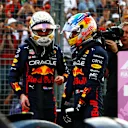 MELBOURNE, AUSTRALIA - APRIL 09: Second placed qualifier Max Verstappen of the Netherlands and Oracle Red Bull Racing and Third placed qualifier Sergio Perez of Mexico and Oracle Red Bull Racing talk in parc ferme during qualifying ahead of the F1 Grand Prix of Australia at Melbourne Grand Prix Circuit on April 09, 2022 in Melbourne, Australia. (Photo by Mark Thompson/Getty Images)