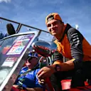 MELBOURNE, AUSTRALIA - APRIL 10: Lando Norris of Great Britain and McLaren smiles on the drivers parade ahead of  the F1 Grand Prix of Australia at Melbourne Grand Prix Circuit on April 10, 2022 in Melbourne, Australia. (Photo by Clive Mason/Getty Images)