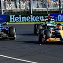 MELBOURNE, AUSTRALIA - APRIL 10: Daniel Ricciardo of Australia driving the (3) McLaren MCL36 Mercedes leads Alexander Albon of Thailand driving the (23) Williams FW44 Mercedes and Lance Stroll of Canada driving the (18) Aston Martin AMR22 Mercedes during the F1 Grand Prix of Australia at Melbourne Grand Prix Circuit on April 10, 2022 in Melbourne, Australia. (Photo by Bill Murray/Getty Images for Heineken)