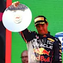 MELBOURNE, AUSTRALIA - APRIL 10: Second placed Sergio Perez of Mexico and Oracle Red Bull Racing celebrates on the podium during the F1 Grand Prix of Australia at Melbourne Grand Prix Circuit on April 10, 2022 in Melbourne, Australia. (Photo by Mark Thompson/Getty Images)
