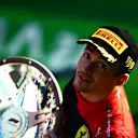 MELBOURNE, AUSTRALIA - APRIL 10: Race winner Charles Leclerc of Monaco and Ferrari celebrates on the podium during the F1 Grand Prix of Australia at Melbourne Grand Prix Circuit on April 10, 2022 in Melbourne, Australia. (Photo by Mario Renzi - Formula 1/Formula 1 via Getty Images)