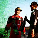 MELBOURNE, AUSTRALIA - APRIL 10: Race winner Charles Leclerc of Monaco and Ferrari and Third placed George Russell of Great Britain and Mercedes talk on the podium during the F1 Grand Prix of Australia at Melbourne Grand Prix Circuit on April 10, 2022 in Melbourne, Australia. (Photo by Dan Istitene - Formula 1/Formula 1 via Getty Images)