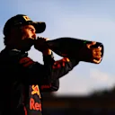 MELBOURNE, AUSTRALIA - APRIL 10: Second placed Sergio Perez of Mexico and Oracle Red Bull Racing celebrates on the podium during the F1 Grand Prix of Australia at Melbourne Grand Prix Circuit on April 10, 2022 in Melbourne, Australia. (Photo by Dan Istitene - Formula 1/Formula 1 via Getty Images)