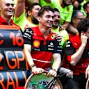 MELBOURNE, AUSTRALIA - APRIL 10: Race winner Charles Leclerc of Monaco and Ferrari celebrates with his team after the F1 Grand Prix of Australia at Melbourne Grand Prix Circuit on April 10, 2022 in Melbourne, Australia. (Photo by Bryn Lennon - Formula 1/Formula 1 via Getty Images)