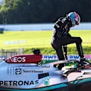 SPIELBERG, AUSTRIA - JULY 08: George Russell of Great Britain and Mercedes walks from his car after a crash during qualifying ahead of the F1 Grand Prix of Austria at Red Bull Ring on July 08, 2022 in Spielberg, Austria. (Photo by Clive Rose/Getty Images)