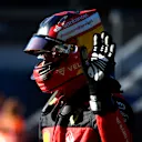 SPIELBERG, AUSTRIA - JULY 08: Third placed qualifier Carlos Sainz of Spain and Ferrari waves in parc ferme during qualifying ahead of the F1 Grand Prix of Austria at Red Bull Ring on July 08, 2022 in Spielberg, Austria. (Photo by Rudy Carezzevoli - Formula 1/Formula 1 via Getty Images)