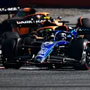 SPIELBERG, AUSTRIA - JULY 09: Alexander Albon of Thailand driving the (23) Williams FW44 Mercedes leads Lando Norris of Great Britain driving the (4) McLaren MCL36 Mercedes and Daniel Ricciardo of Australia driving the (3) McLaren MCL36 Mercedes during the F1 Grand Prix of Austria Sprint at Red Bull Ring on July 09, 2022 in Spielberg, Austria. (Photo by Rudy Carezzevoli - Formula 1/Formula 1 via Getty Images)