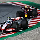 SPIELBERG, AUSTRIA - JULY 09: Mick Schumacher of Germany driving the (47) Haas F1 VF-22 Ferrari leads Sergio Perez of Mexico driving the (11) Oracle Red Bull Racing RB18 during the F1 Grand Prix of Austria Sprint at Red Bull Ring on July 09, 2022 in Spielberg, Austria. (Photo by Joe Portlock - Formula 1/Formula 1 via Getty Images)
