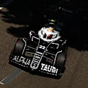 BAKU, AZERBAIJAN - JUNE 12: Yuki Tsunoda of Japan driving the (22) Scuderia AlphaTauri AT03 on his way to the grid ahead of the F1 Grand Prix of Azerbaijan at Baku City Circuit on June 12, 2022 in Baku, Azerbaijan. (Photo by Clive Rose/Getty Images)