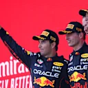 BAKU, AZERBAIJAN - JUNE 12: Race winner Max Verstappen of the Netherlands and Oracle Red Bull Racing (second from left), Second placed Sergio Perez of Mexico and Oracle Red Bull Racing (L), Third placed George Russell of Great Britain and Mercedes (R) and Tom Hart Performance Engineer at Red Bull Racing (second from right) celebrate on the podium during the F1 Grand Prix of Azerbaijan at Baku City Circuit on June 12, 2022 in Baku, Azerbaijan. (Photo by Bryn Lennon - Formula 1/Formula 1 via Getty Images)