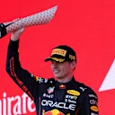 BAKU, AZERBAIJAN - JUNE 12: Race winner Max Verstappen of the Netherlands and Oracle Red Bull Racing celebrates on the podium during the F1 Grand Prix of Azerbaijan at Baku City Circuit on June 12, 2022 in Baku, Azerbaijan. (Photo by Bryn Lennon - Formula 1/Formula 1 via Getty Images)