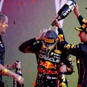 BAKU, AZERBAIJAN - JUNE 12: Race winner Max Verstappen of the Netherlands and Oracle Red Bull Racing, Second placed Sergio Perez of Mexico and Oracle Red Bull Racing and Tom Hart, Performance Engineer at Red Bull Racing celebrate on the podium during the F1 Grand Prix of Azerbaijan at Baku City Circuit on June 12, 2022 in Baku, Azerbaijan. (Photo by Dan Istitene - Formula 1/Formula 1 via Getty Images)