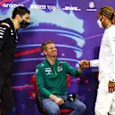BAHRAIN, BAHRAIN - MARCH 18: Lewis Hamilton of Great Britain and Mercedes (R) and Esteban Ocon of France and Alpine F1 (L) greet Nico Hulkenberg of Germany and Aston Martin F1 Team (C) to the Drivers Press Conference before practice ahead of the F1 Grand Prix of Bahrain at Bahrain International Circuit on March 18, 2022 in Bahrain, Bahrain. (Photo by Lars Baron/Getty Images)