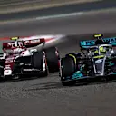 BAHRAIN, BAHRAIN - MARCH 20: Lewis Hamilton of Great Britain driving the (44) Mercedes AMG Petronas F1 Team W13 leads Zhou Guanyu of China driving the (24) Alfa Romeo F1 C42 Ferrari during the F1 Grand Prix of Bahrain at Bahrain International Circuit on March 20, 2022 in Bahrain, Bahrain. (Photo by Lars Baron/Getty Images)