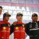 BAHRAIN, BAHRAIN - MARCH 20: Race winner Charles Leclerc of Monaco and Ferrari (second from right), Second placed Carlos Sainz of Spain and Ferrari (second from left) Third placed Lewis Hamilton of Great Britain and Mercedes (R) and Scuderia Ferrari Team Principal Mattia Binotto (L) celebrate on the podium during the F1 Grand Prix of Bahrain at Bahrain International Circuit on March 20, 2022 in Bahrain, Bahrain. (Photo by Clive Rose - Formula 1/Formula 1 via Getty Images)