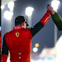 BAHRAIN, BAHRAIN - MARCH 20: Race winner Charles Leclerc of Monaco and Ferrari celebrates on the podium during the F1 Grand Prix of Bahrain at Bahrain International Circuit on March 20, 2022 in Bahrain, Bahrain. (Photo by Dan Istitene - Formula 1/Formula 1 via Getty Images)