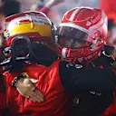 BAHRAIN, BAHRAIN - MARCH 20: Race winner Charles Leclerc of Monaco and Ferrari and Second placed Carlos Sainz of Spain and Ferrari celebrate with their team in parc ferme during the F1 Grand Prix of Bahrain at Bahrain International Circuit on March 20, 2022 in Bahrain, Bahrain. (Photo by Dan Istitene - Formula 1/Formula 1 via Getty Images)