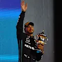 BAHRAIN, BAHRAIN - MARCH 20: Third placed Lewis Hamilton of Great Britain and Mercedes celebrates on the podium during the F1 Grand Prix of Bahrain at Bahrain International Circuit on March 20, 2022 in Bahrain, Bahrain. (Photo by Clive Rose - Formula 1/Formula 1 via Getty Images)